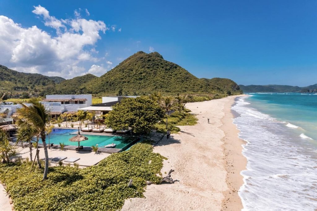 Infinity pool overlooking Torok Bay at Amber Lombok Beach Resort near Selong Belanak